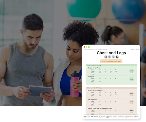 Personal Trainer Viewing Client Workouts On Mobile Device Personal Trainer with client looking at tablet displaying client workouts while at the gym.